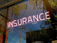 Neon sign in insurance office window